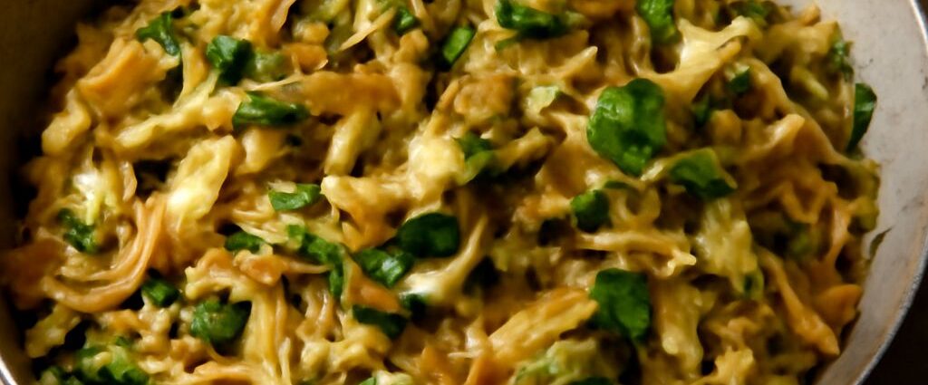 Seasoned cabbage cooked in a skillet on the stove