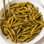 Seasoned canned green beans in a serving bowl