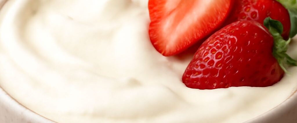 Dairy free whipped topping in a bowl with soft peaks