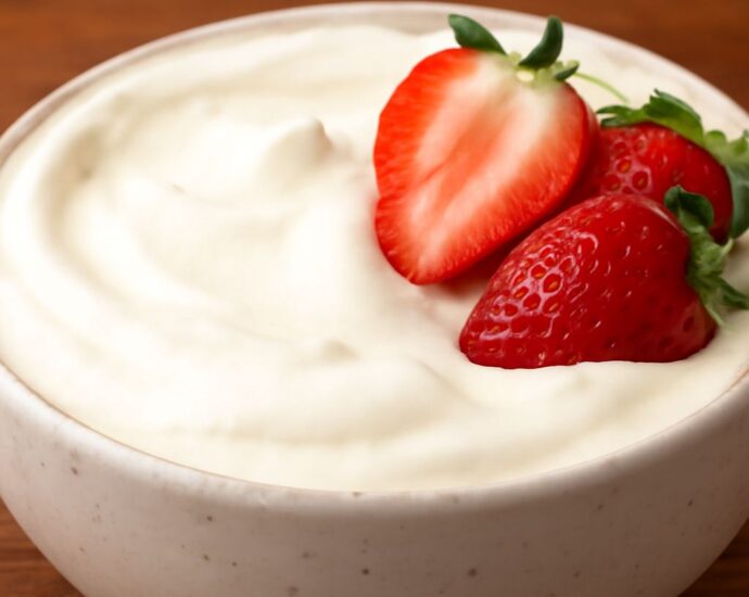 Dairy free whipped topping in a bowl with soft peaks