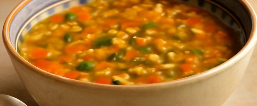 A pot of cooked great Northern beans simmering on the stove