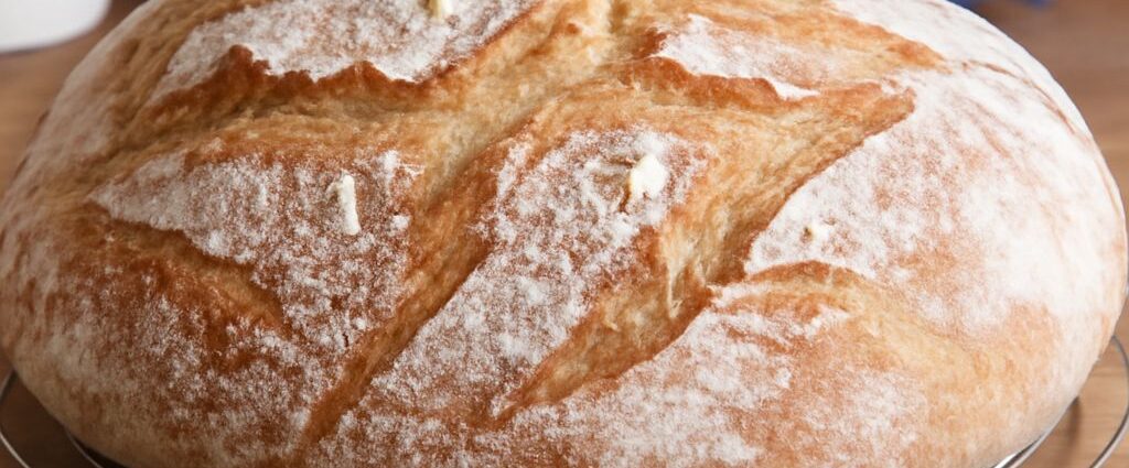 Homemade potato bread recipe with sliced loaf and fresh potatoes