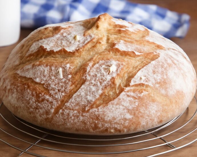 Homemade potato bread recipe with sliced loaf and fresh potatoes