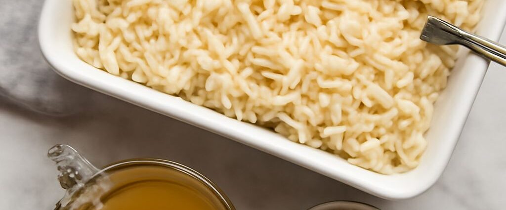Fluffy white rice baked in a ceramic dish, ready to serve.