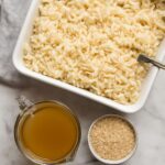 Fluffy white rice baked in a ceramic dish, ready to serve.