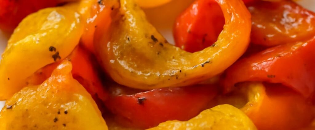 A tray of delicious oven roasted bell peppers showing how to roast peppers in oven settings.