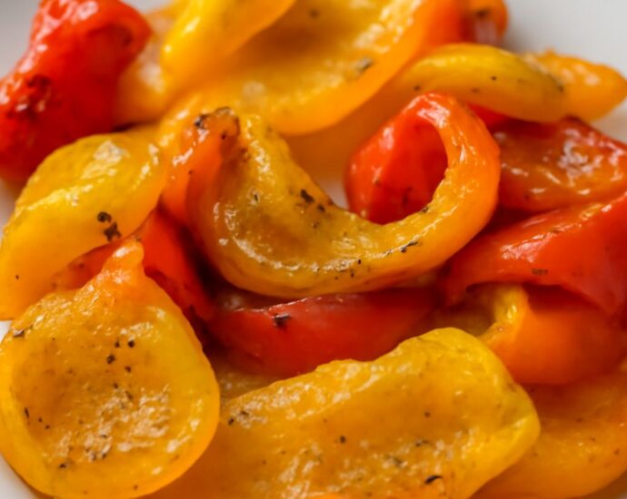 A tray of delicious oven roasted bell peppers showing how to roast peppers in oven settings.