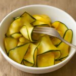 Jar of quick pickled zucchini with herbs and sliced zucchini