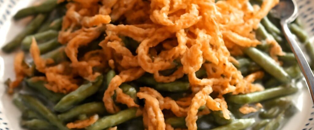 Slow cooker green bean casserole with creamy mushroom sauce and crispy onions