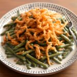 Slow cooker green bean casserole with creamy mushroom sauce and crispy onions