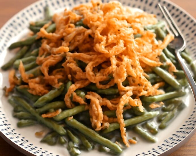 Slow cooker green bean casserole with creamy mushroom sauce and crispy onions