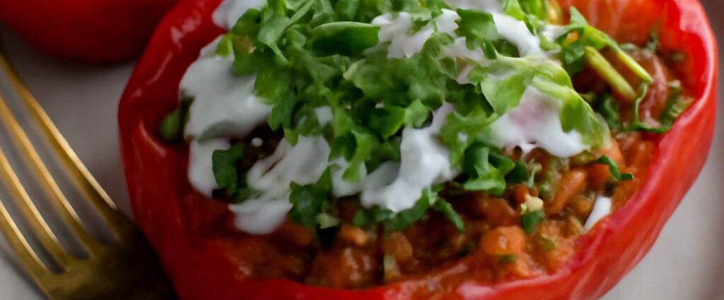 Taco stuffed peppers filled with seasoned vegetables and rice