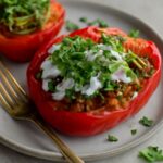 Taco stuffed peppers filled with seasoned vegetables and rice