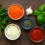 Tomato sauce made from tomato paste in a bowl with herbs