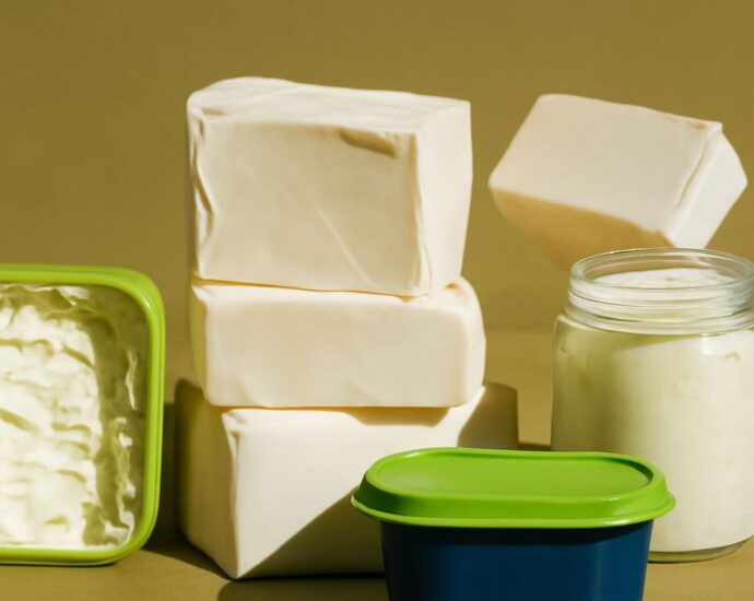 vegan butter substitute lineup with vegan butter alternatives on a board