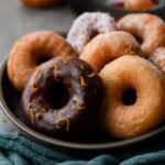vegan donuts platter beside vegan donut recipe cards