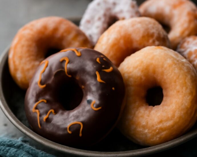 vegan donuts platter beside vegan donut recipe cards