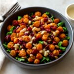 colorful vegan salad with fresh vegetables and plant-based toppings