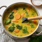 A bowl of vegetarian Japanese curry with rice and colorful vegetables.