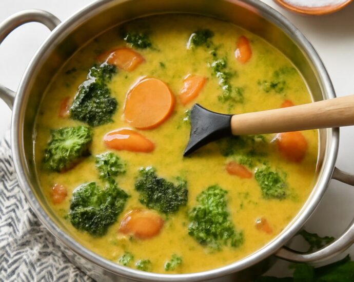 A bowl of vegetarian Japanese curry with rice and colorful vegetables.