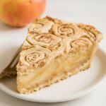 Glazed apple cinnamon roll bake with tender apple chunks and pull-apart dough