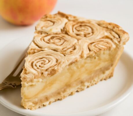 Glazed apple cinnamon roll bake with tender apple chunks and pull-apart dough