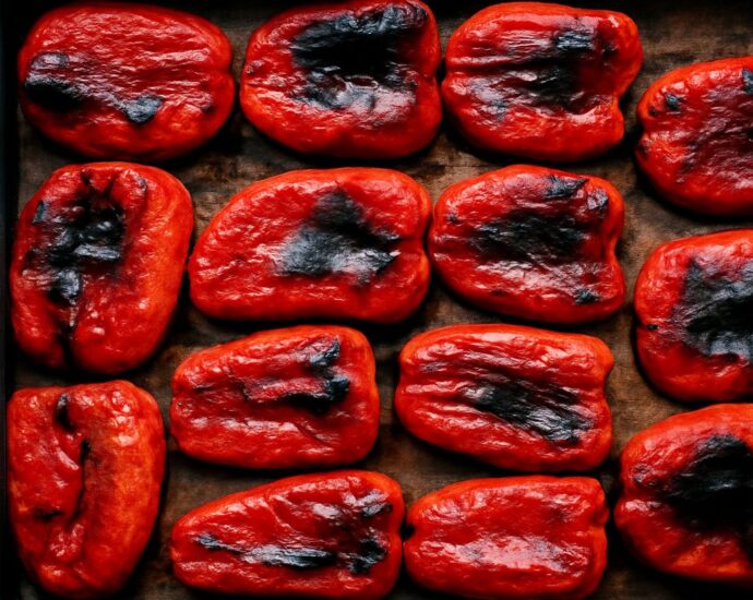 Tender browned pepper wedges on a baking sheet