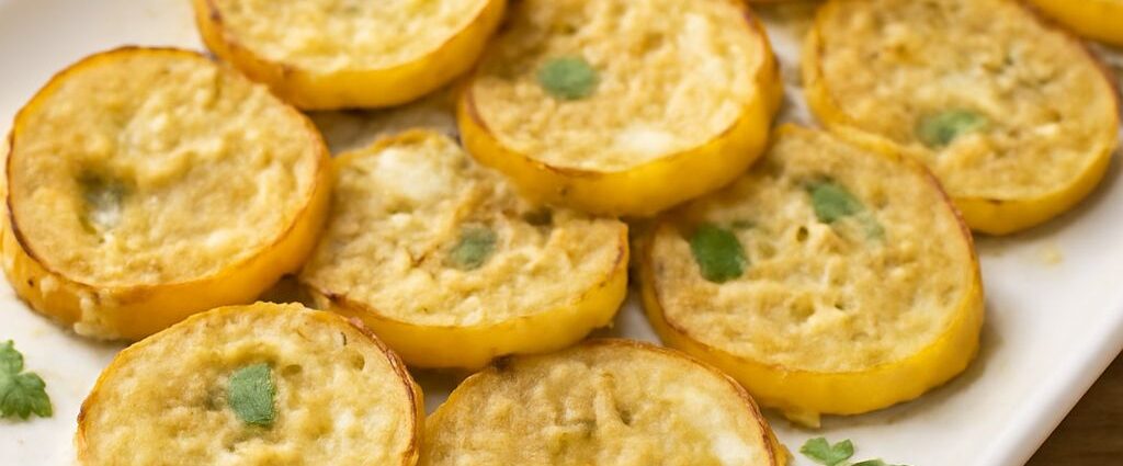 Baked yellow squash recipe in an 8-inch dish with a browned savory breadcrumb topping