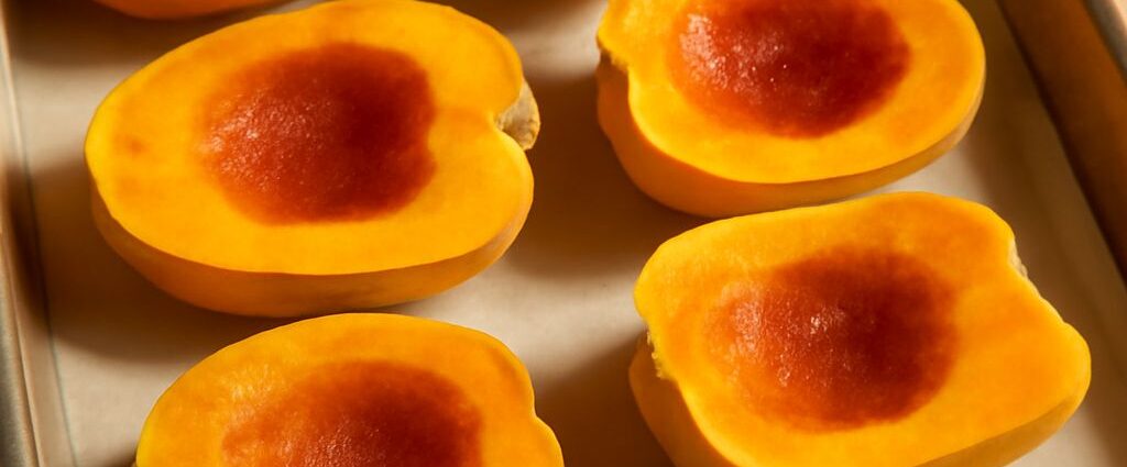 Roasted carnival squash halves with caramelized edges and creamy flesh