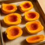 Roasted carnival squash halves with caramelized edges and creamy flesh