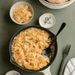 Cheesy cauliflower casserole with tender florets, creamy sauce, and a browned cheese topping