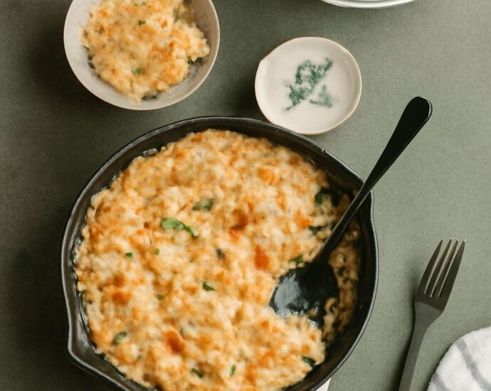 Cheesy cauliflower casserole with tender florets, creamy sauce, and a browned cheese topping