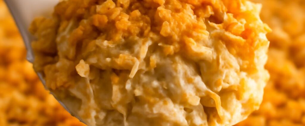 Cheesy potato casserole with a crisp corn-flake topping in a baking dish