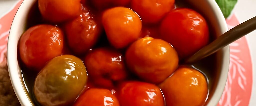 Cherry tomato confit in aromatic olive oil with garlic and herbs