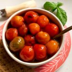 Cherry tomato confit in aromatic olive oil with garlic and herbs