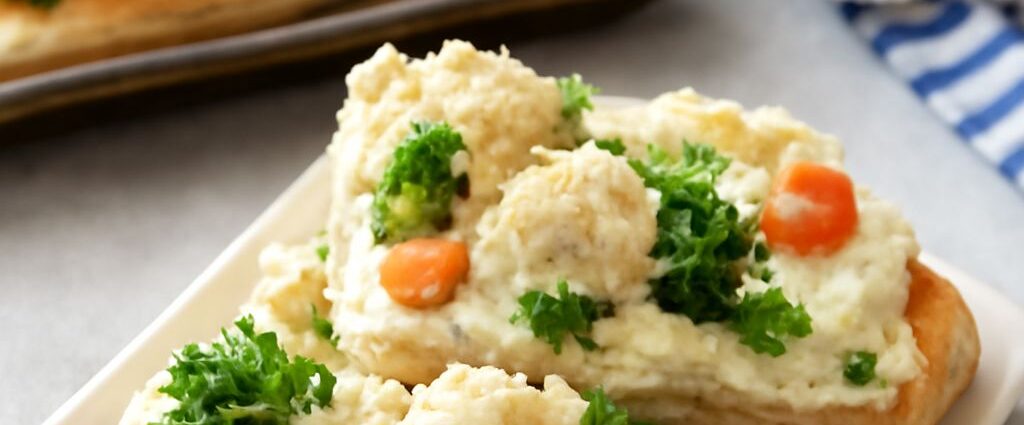 Chilled crescent-roll vegetable pizza squares topped with finely chopped broccoli, carrots, and bell pepper