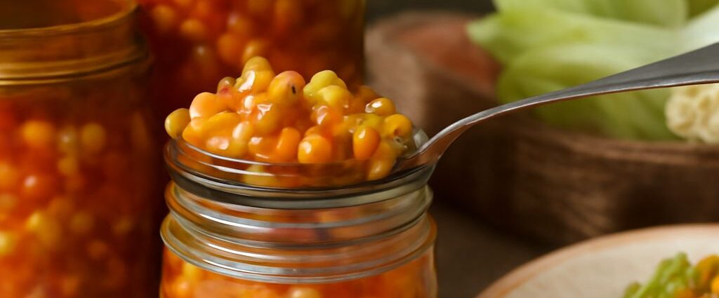 Bright corn relish with yellow corn, red peppers, and onion in a bowl