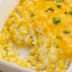 Corn cream cheese casserole with whole-kernel corn and a browned top