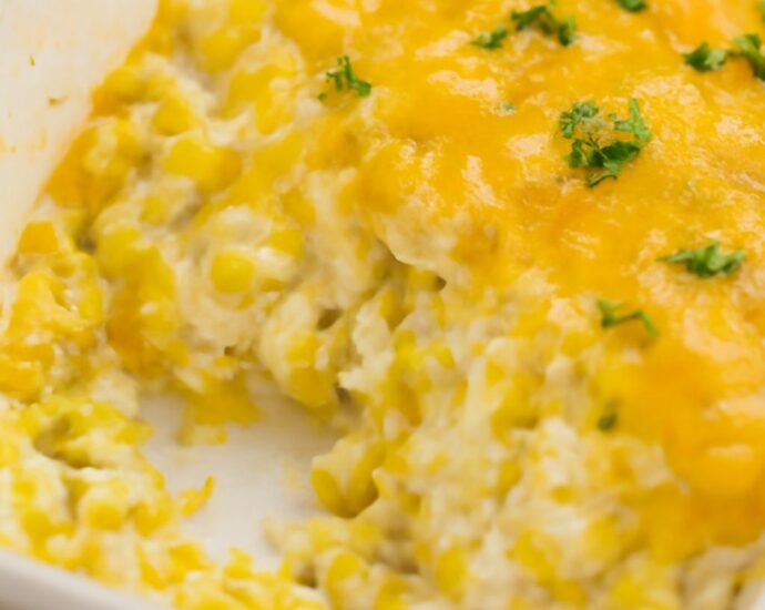 Corn cream cheese casserole with whole-kernel corn and a browned top