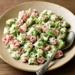 Cucumber feta salad with tomatoes, block feta, fresh herbs, and vinaigrette