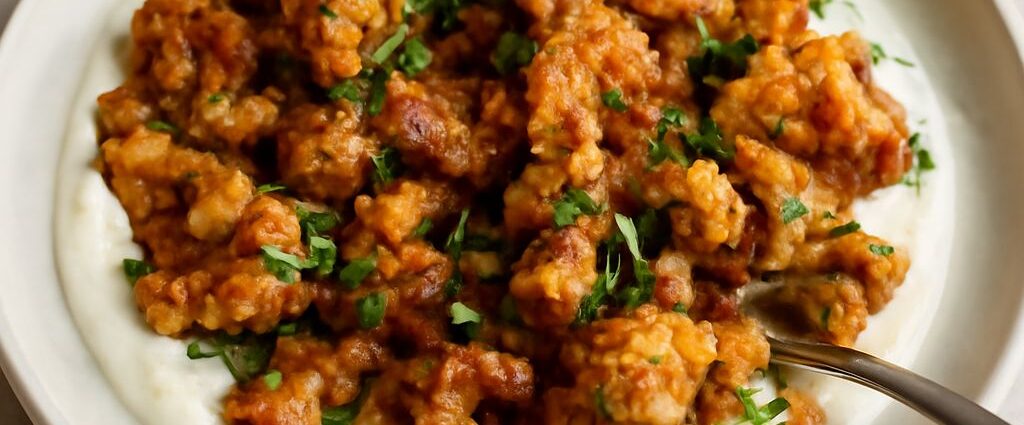 Browned cauliflower florets with a toasted curry coating on a sheet pan