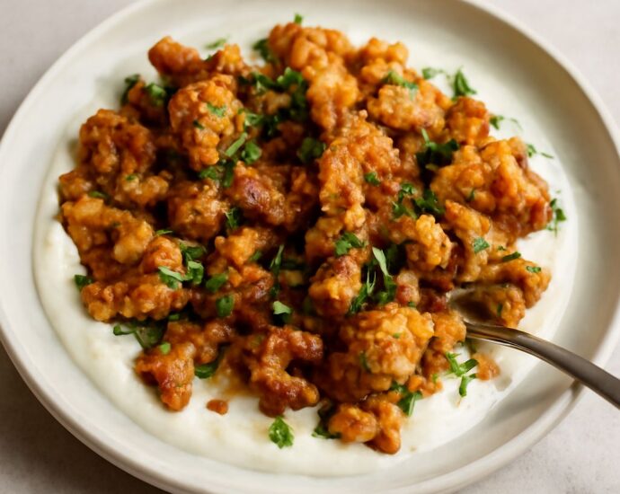 Browned cauliflower florets with a toasted curry coating on a sheet pan