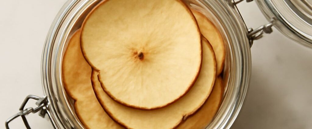 Apple slices drying on a dehydrator tray until chewy or crisp