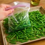 Freezing string beans after blanching beside an ice bath