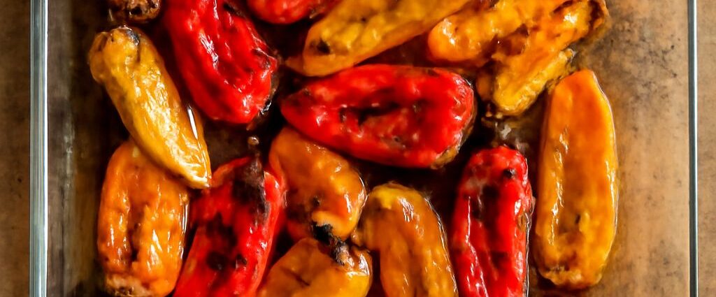 A platter of mini sweet peppers in four preparations