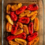A platter of mini sweet peppers in four preparations
