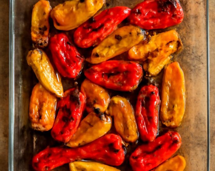 A platter of mini sweet peppers in four preparations