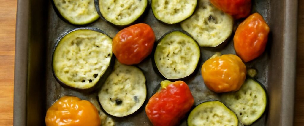 Oven roasted zucchini and yellow squash with browned edges on a sheet pan