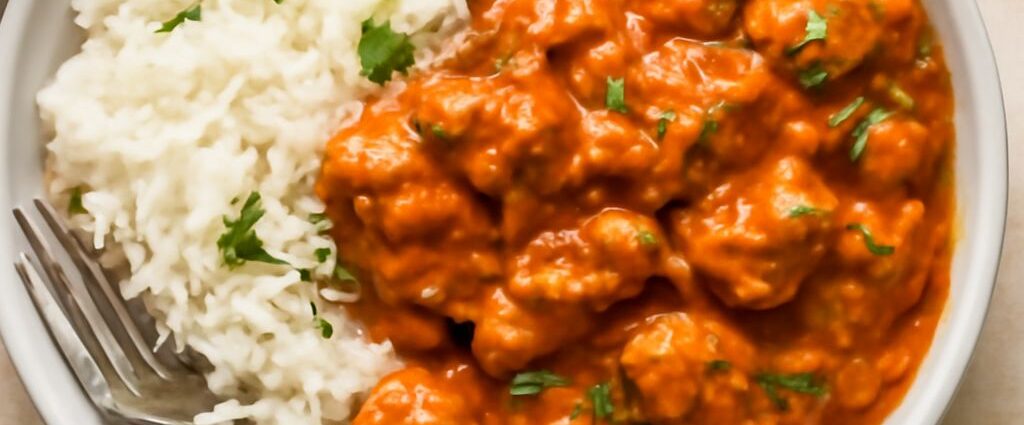 A rice bowl recipe with warm rice, cooked vegetables, fresh toppings, and sauce