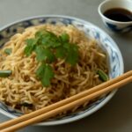 Thin rice noodle stir-fry with vegetables and herbs